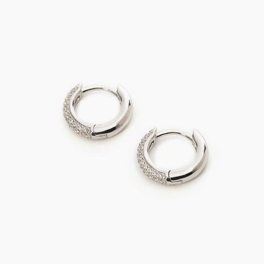 Par de aretes circulares fijos con circonitas 563521